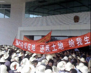 Residents of Nanwan village in southern Guangdong province protest outside a government building against alleged corruption surrounding a farm built on their land.