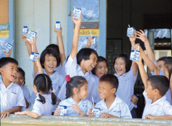 The Swedish corporation Tetra Pak dominates the global market for pasteurised milk packaging, and encourages the consumption of  packaged and processed milk by sponsoring school milk programmes such as  this one in Thailand. It also has a large corporate division, known as DeLaval, that "develops, manufactures and markets equipment and complete systems for milk production and animal husbandry" in more than 100 countries. In Pakistan, DeLaval is implementing a "Dairy Hub" programme in collaboration with the government and several dairy processors to develop larger-scale, modern, commercial dairy farms. Its "Dairy Hub" promotional video maintains: "The traditional approach of the farmer and his lack of knowledge about modern dairy farming is the single most important barrier impeding milk from achieving its true potential."