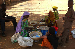 Woman selling milk and millet mixture in Zinder, Niger.