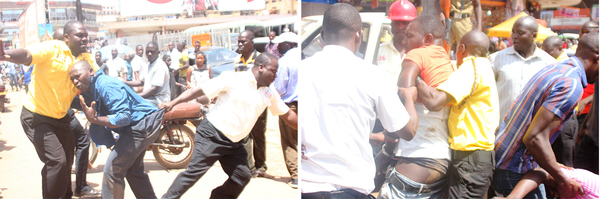 Des employés des autorités de la capitale de Kampala chassent un vendeur de rue du centre-ville le 25 octobre 2018, au cours d’une expédition de répression où 20 vendeurs de cuisine de rue ont été arrêtés et ont vu leur propriété détruite ou confisquée. 